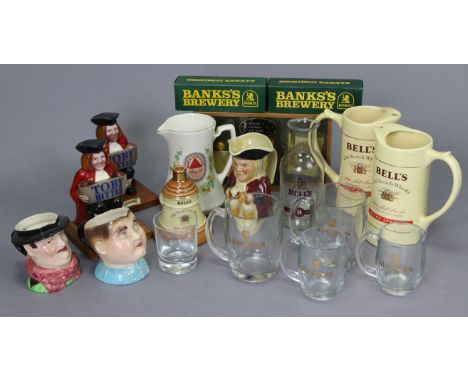 A Bell's scotch whisky winter warmer gift pack; two ditto bar jugs; three various character &amp; toby jugs, etc. 