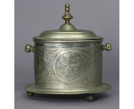 An eastern white metal oval tea caddy with embossed stylised decoration, hinged lid, &amp; on three small feet; 6¼” wide x 6¾