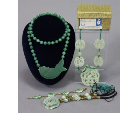 Three jade pendant necklaces; a jade bracelet; &amp; a pair of jade earrings. 