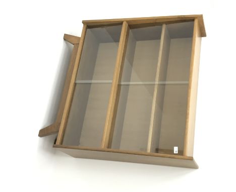 Light oak bookcase, sliding glass doors enclosing two shelves, W101cm, H108cm, D31cm Condition Report Click here for further 