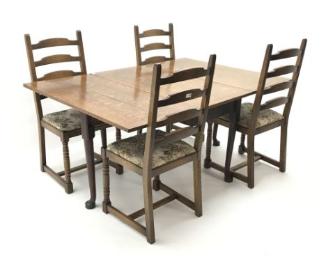 Early 20th century oak drop leaf dining table, turned supports on pad feet (W112cm, H71cm, D162cm) and five oak ladder back d