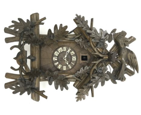 20th century Black Forest style Cuckoo clock, with carved acorn and bird cresting, Roman dial with twin weight movement, H59c