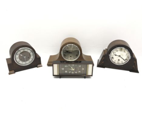 Two 20th century oak cased mantel clocks with three train movements chiming on rods, a similar twin train half hour strike ma
