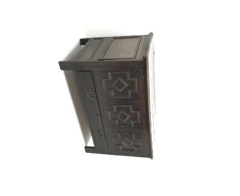 Late 18th century oak mule chest, hinged lid, geometric patterned front panel above single drawer, stile supports, W122cm, H7