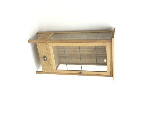 Light oak display cabinet, single door enclosing three glazed shelves, single drawer, stile supports, W68cm, H128cm, D39cm Co