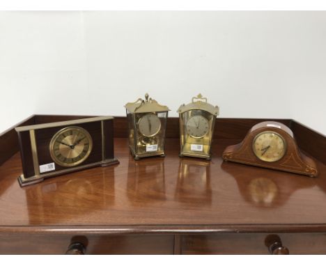 Edwardian inlaid mahogany mantel timepiece, two Schatz anniversary clocks in gilt metal cases and a 1970's Metamec mantel clo