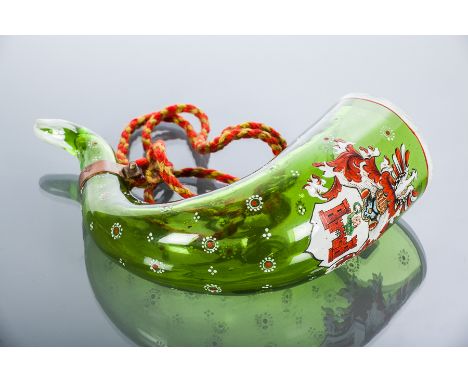 HISTORISMUS STYLE GREEN GLASS DRINKING HORN
in 'renaissance revival style', with glass ring and brass attachment strung with 