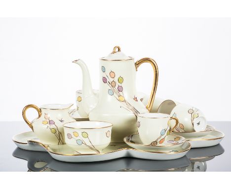 20TH CENTURY CABARET COFFEE SET
comprising coffee pot, sugar and cream and six cups, six saucers and a shaped tray, decorated