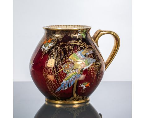 CARLTON WARE ROUGE ROYALE 'FLYING HERON' JUG
with gilt handle and gilt details with raised enamel to the heron and stylised f