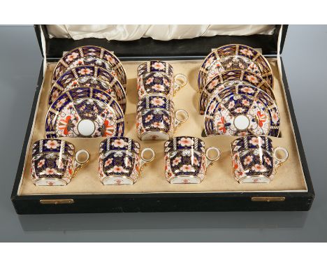 ROYAL CROWN DERBY IMARI COFFEE SET
six cans and saucers, with red factory stamp and pattern number 2451, wear to the gilding 