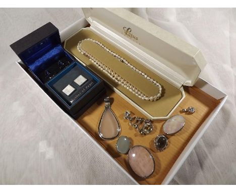 A mixed lot of jewellery to include a cultured single stranded pearl necklace, fresh water pearl necklace, a pair of gentlema