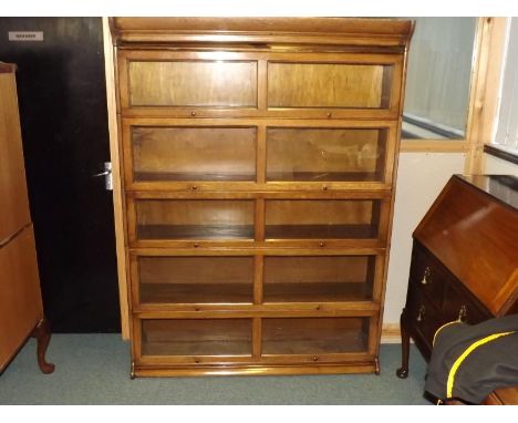 A Globe Wernicke style five tier stacking bookcase with glazed up and over doors, 174 cm (h) x 129 cm (w) x 36.5 cm (d)