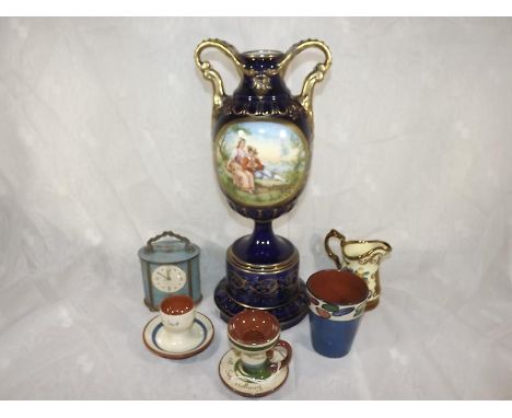 A mixed lot to include a Czechoslovakian twin handled vase, factory marks to the base PCV, a mantel clock, Torquay ware and o