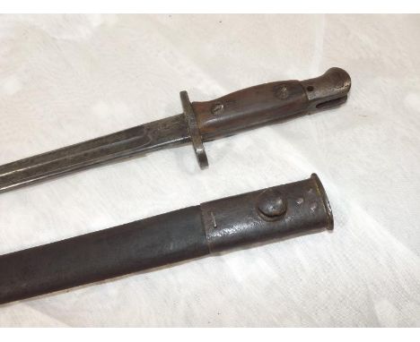 An early 20th century bayonet, the blade marked Sanderson 1907 and leather scabbard, 53.5cm (l) Est £40 - £60