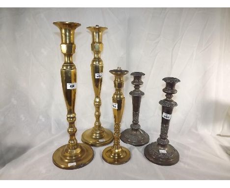 Three brass table lamp stands and two silver plated candle sticks (5)