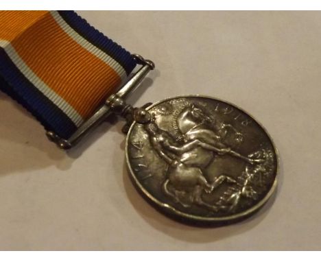 A World War One (WWI) campaign medal, the British War medal inscribed to the rim 59394 Pte J R Edmondson R S Fus, with ribbon