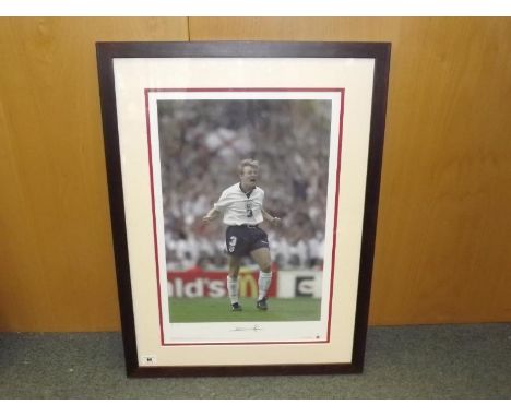 A print depicting Stuart Pearce, issued in a limited edition of 500 (No.9) signed to the margin by Pearce, mounted and framed