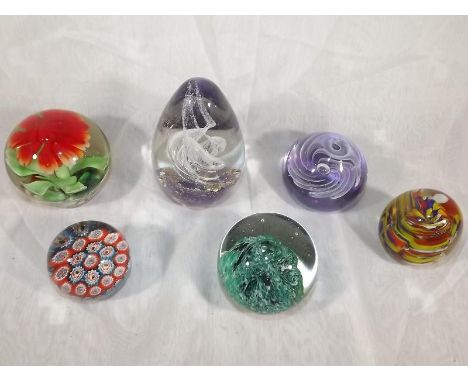 Six glass paperweights to include Caithness sea form and other (6) 