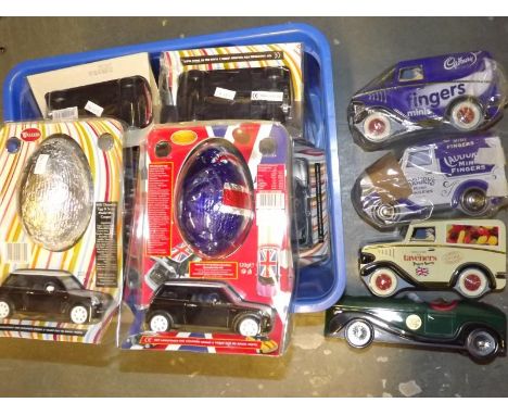Seven Easter presentation packs containing model Mini-Coopers with detailed interior and engine, opening bonnet and doors and