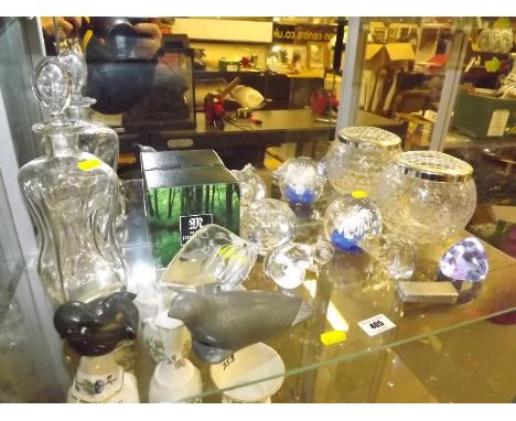 A good mixed lot to include predominantly paperweights by Caithness, Wedgwood, Mats Jonasson, natural stone carved sea lion a