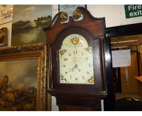 An early 19th century oak and cross-banded mahogany cased longcase clock, the 13inch arched painted dial having Arabic numera