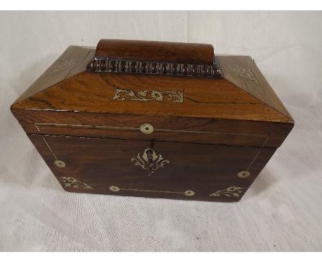 A 19th Century rosewood sarcophagus tea caddy with mother of pearl inlaid decoration, the hinged lid enclosing a lined interi
