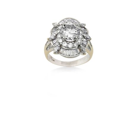 An 18 Carat White Gold Diamond Cluster Ringthe central round brilliant cut diamond within a border of smaller round brilliant