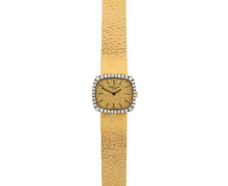Patek Philippe: A Lady's 18 Carat Gold Diamond Set Wristwatch, signed Patek Philippe, Geneve, ref: 4197/1, circa 1970, (calib