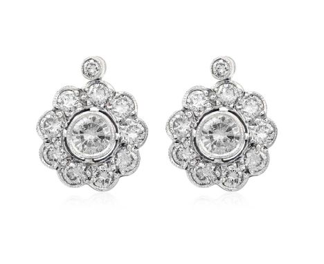 A Pair of Diamond Cluster Drop Earringsthe central round brilliant cut diamond within a spaced border of smaller round brilli