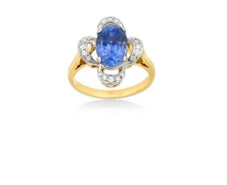 A Sapphire and Diamond Cluster Ringthe oval cut sapphire within an openwork border of round brilliant cut diamonds, in white 