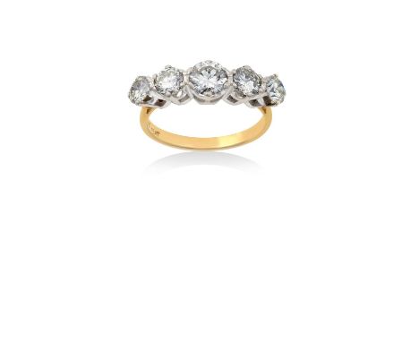 A Diamond Five Stone Ringthe graduated round brilliant cut diamonds in white claw settings, to a yellow tapered shoulder plai