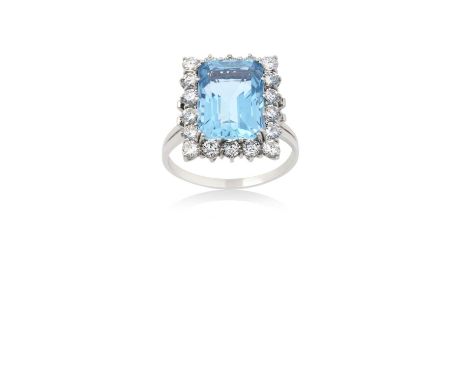 An Aquamarine and Diamond Cluster Ringthe emerald-cut aquamarine within a border of round brilliant cut diamonds, in white cl