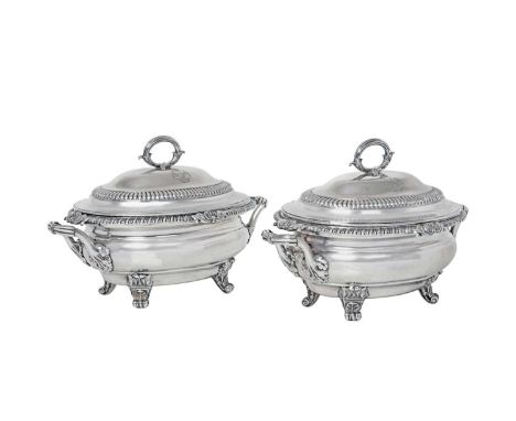 A Pair of George III Silver Sauce-Tureens and Covers,  by Robert Garrard, London, 1817 each oval bombé and on four leaf and s