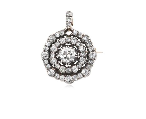 A Diamond Brooch/Pendant the central old cut diamond within a double spaced border of smaller old cut diamonds, suspended fro