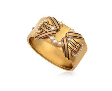 A Victorian Enamel and Split Pearl Hinged Banglethe satin finish overlaid with a horseshoe motif set throughout with split pe