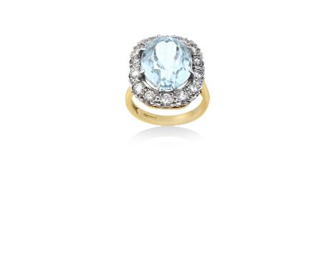 An 18 Carat Gold Aquamarine and Diamond Cluster Ringthe oval cut aquamarine within a border of round brilliant cut diamonds, 