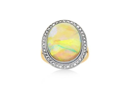 An Opal and Diamond Cluster Ringthe oval cabochon opal within a border of rose cut diamonds, in white millegrain settings, to