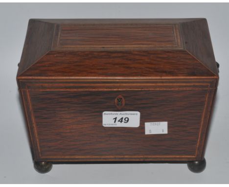 A mahogany sarcophagus shaped tea caddy , lion mask brass handles (faults)