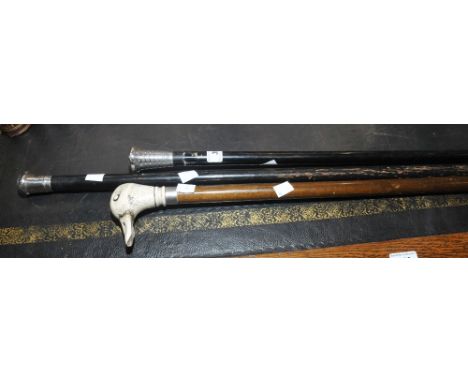 A Gentleman's silver topped malacca shaft walking cane; another ; a Gentleman's walking stick, duck head handle (3)