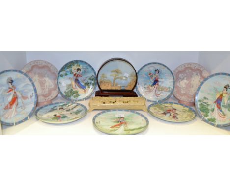 A set of seven Oriental collectors plates;  a cork model;  a resin elongated trinket box, moulded with dragons;  a pair of Ro