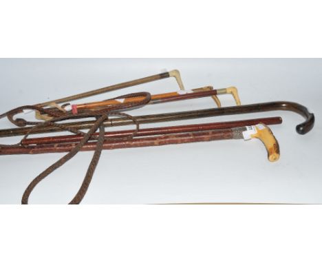 Country Pursuits - a horn handled riding crop, others; a horn handled, silver ferrule, walking stick; a leather swagger stick