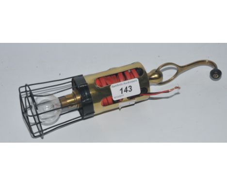 A brass inspection lamp made by Lucas, for an M G TD sports car