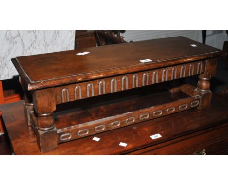 A mid 20th Century oak room tidy/magazine rack; a Jacobean style miniature bench.