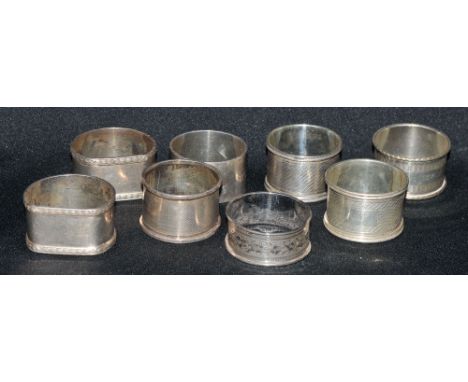 A pair of silver napkin rings, engine turned;  others, various (8)