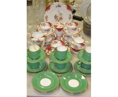 A Paragon Rockingham part tea service;  an Aynsley part tea service, green glazed, detachable plated holders