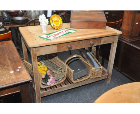 A 20th Century pine kitchen table, single drawer to frieze with tapered legs, slatted lower tier shelf