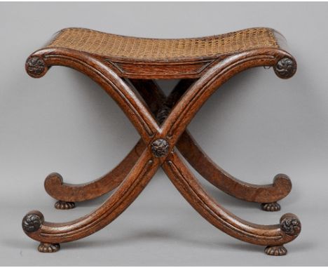 An early 19th century oak X-framed stool, attributed to Gillows
The caned seat supported on chanelled uprights, standing on g