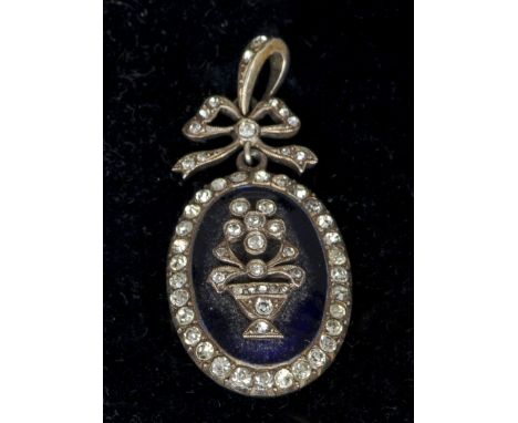 A 19th century blue enamel and paste set yellow metal backed pendant
Of oval form, centred with an urn issuing flowers, the s