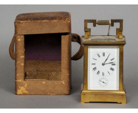 A 19th century brass cased carriage alarm clock
Of typical form, the white enamel dial with Roman and Arabic numerals.  13.5 