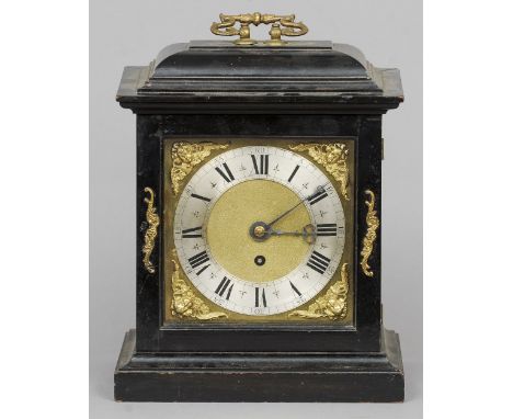 An ebonised bracket clock
The 7 2/8th inch dial with silvered chapter ring, putti mask spandrels and five pillar verge moveme